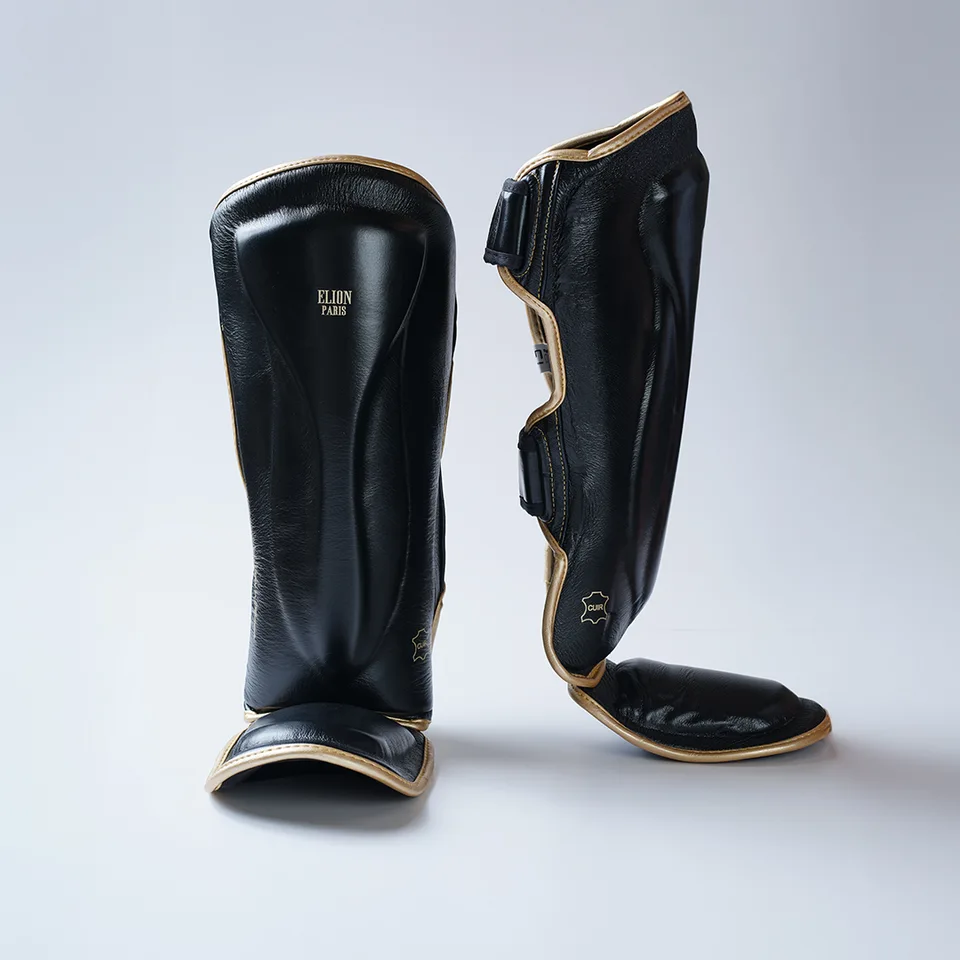 Protège-tibias et pieds Elion, cuir noir et or